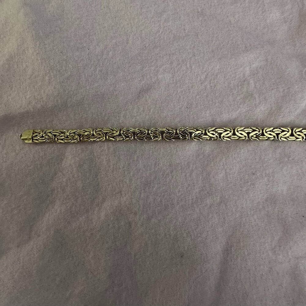 Solid 14Kt Gold Byzantine 7m wide 7 inches long bracelet.